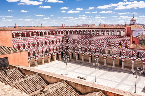 View from above facades of the colorful buildings and houses in the Alta Square in Badajoz (Spain)