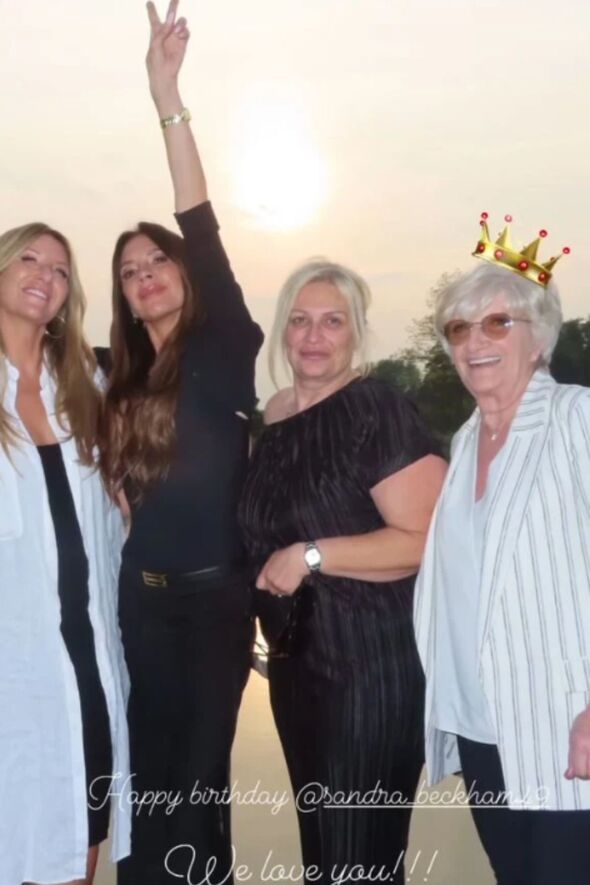 Victoria posing with David's sisters and mum