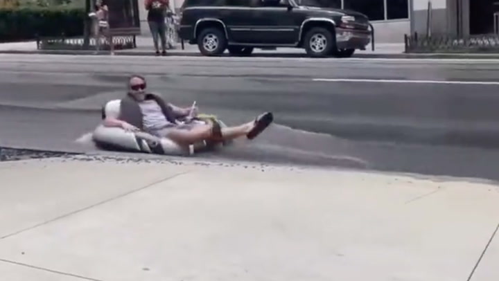 Person floats down flooded Atlanta street as city enters day 5 of water main breaks