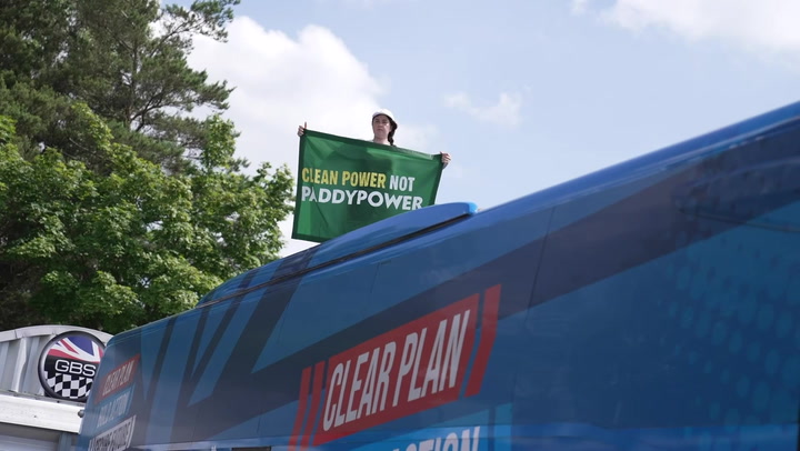 Climate protester climbs Conservative 'battle bus' ahead of James Cleverly campaign visit