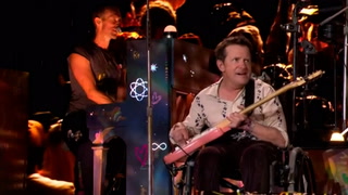 Watch: Michael J. Fox joins Coldplay to perform on Glastonbury stage 