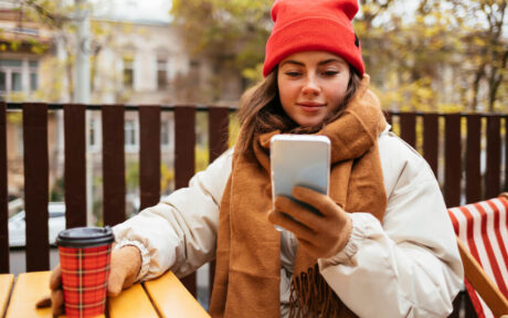 Lady looking for loans while drinking coffee