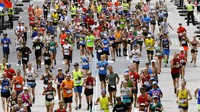 In this April 17, 2017, file photo, runners head down the stretch to the finish line in the 121st Boston Marathon in Boston. (AP Photo/Charles Krupa)