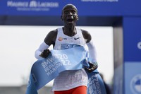 Kenya's Eliud Kipchoge crosses the line to win the Berlin Marathon in Berlin, Germany, on Sept. 25, 2022. (AP Photo/Christoph Soeder)