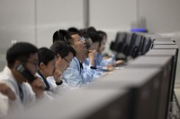 In this photo released by Xinhua News Agency, technical personnel work at the Beijing Aerospace Control Center (BACC) in Beijing, Sunday, June 2, 2024. (Jin Liwang/Xinhua via AP)