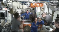 NASA astronauts Butch Wilmore and Suni Williams are greeted by the crew of the International Space Station on June 6, 2024. (NASA via AP)