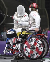 Japan's Anri Sakurai, back, competes in the women's foil category wheelchair fencing event in the Paris Paralympics, at the Grand Palais in Paris on Sept. 4, 2024. (Kyodo)