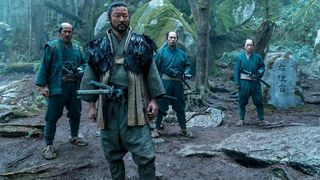 Four Japanese warriors standing in a woodland area