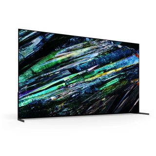 65-inch Sony A95L QD-OLED TV on a white background with green and blue shards on the screen