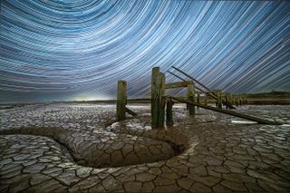 Trailing radial stars over mudflats