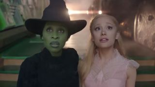 Cynthia Erivo and Ariana Grande looking forward as Glinda and Elphaba in Wicked