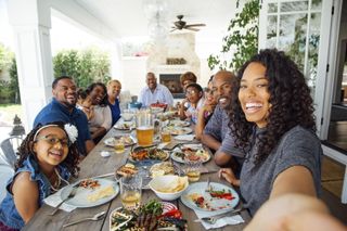 large family sitting at dinner table