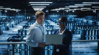 two people on mezzanine in data center