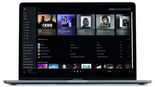 Tidal's Home interface displayed on an Apple Macbook Pro laptop