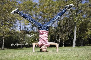 girl doing headstand