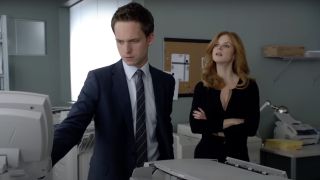 Patrick J. Adams and Sarah Rafferty in Suits