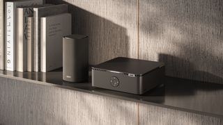 Loewe multi.room amplifier on a bookshelf