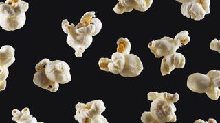 Popcorn against a black background
