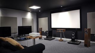 What Hi-Fi? test room featuring two TVs, a projector and screen and several speakers