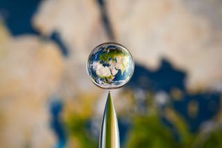 Earth in a water droplet