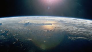 A stock image of the Pacific Ocean at sunset from space. 