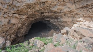 Entrance to the western passage. Note the team members on the right hand wall for scale.