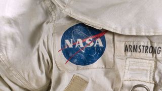 NASA&#039;s official insignia, nicknamed the &quot;meatball,&quot; as worn on the moon by Apollo 11 astronaut Neil Armstrong in 1969. 