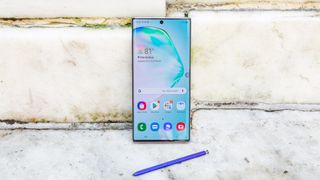 Galaxy Note 10 Plus S Pen near stone wall