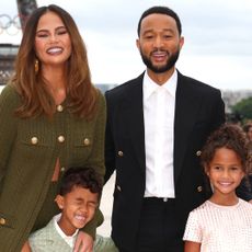 Chrissy Teigen and John Legend attend with son Miles and daughter Luna the red carpet ahead of the opening ceremony of the Olympic Games Paris 2024 on July 26, 2024 in Paris, France.