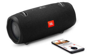 JBL Xtreme 2 Bluetooth speaker next to a phone