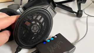 Sennheiser HD 660S2 over-ear headphones pictured next to a Chord Mojo 2