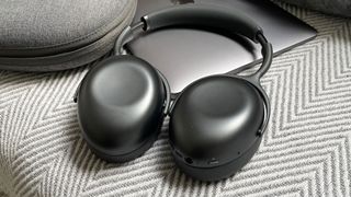 KEF Mu7 wireless headphones resting on a MacBook Air