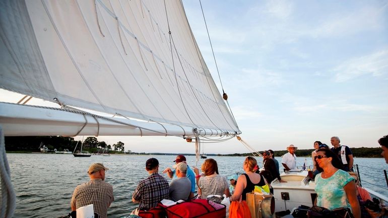 Passengers take in the views on the Waterfront Center’s oyster...