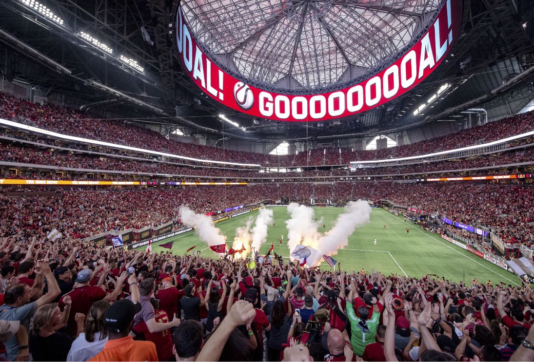 Atlanta United fans cheering at stadium during match