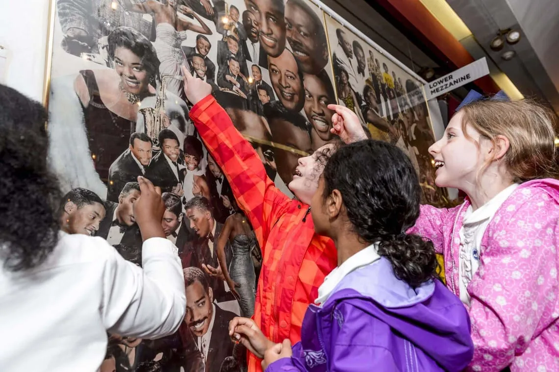 Children playing with a mural