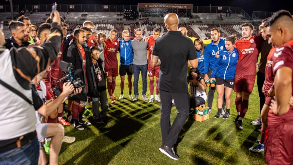 Republic coach Mark Briggs addresses the players after the Round of 16 win