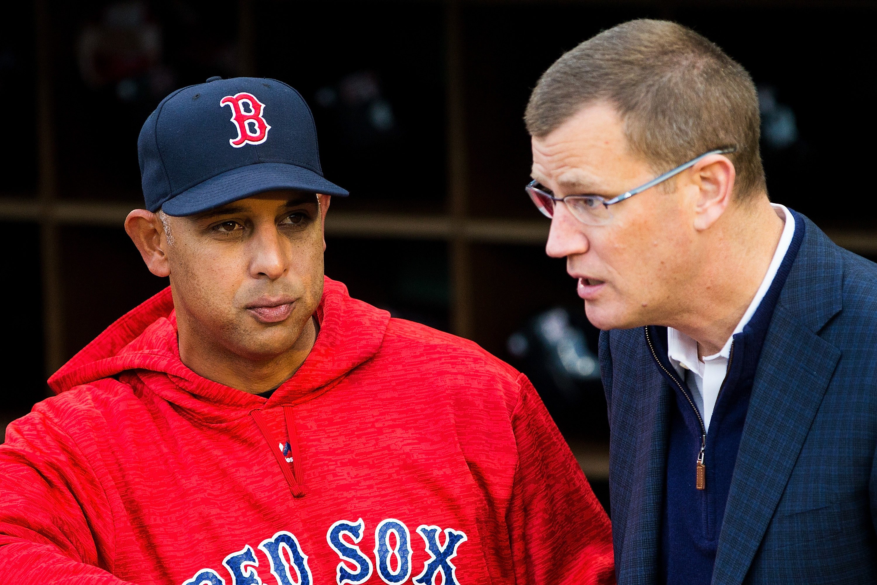 Red Sox CEO and president Sam Kennedy talks to manager Alex Cora.