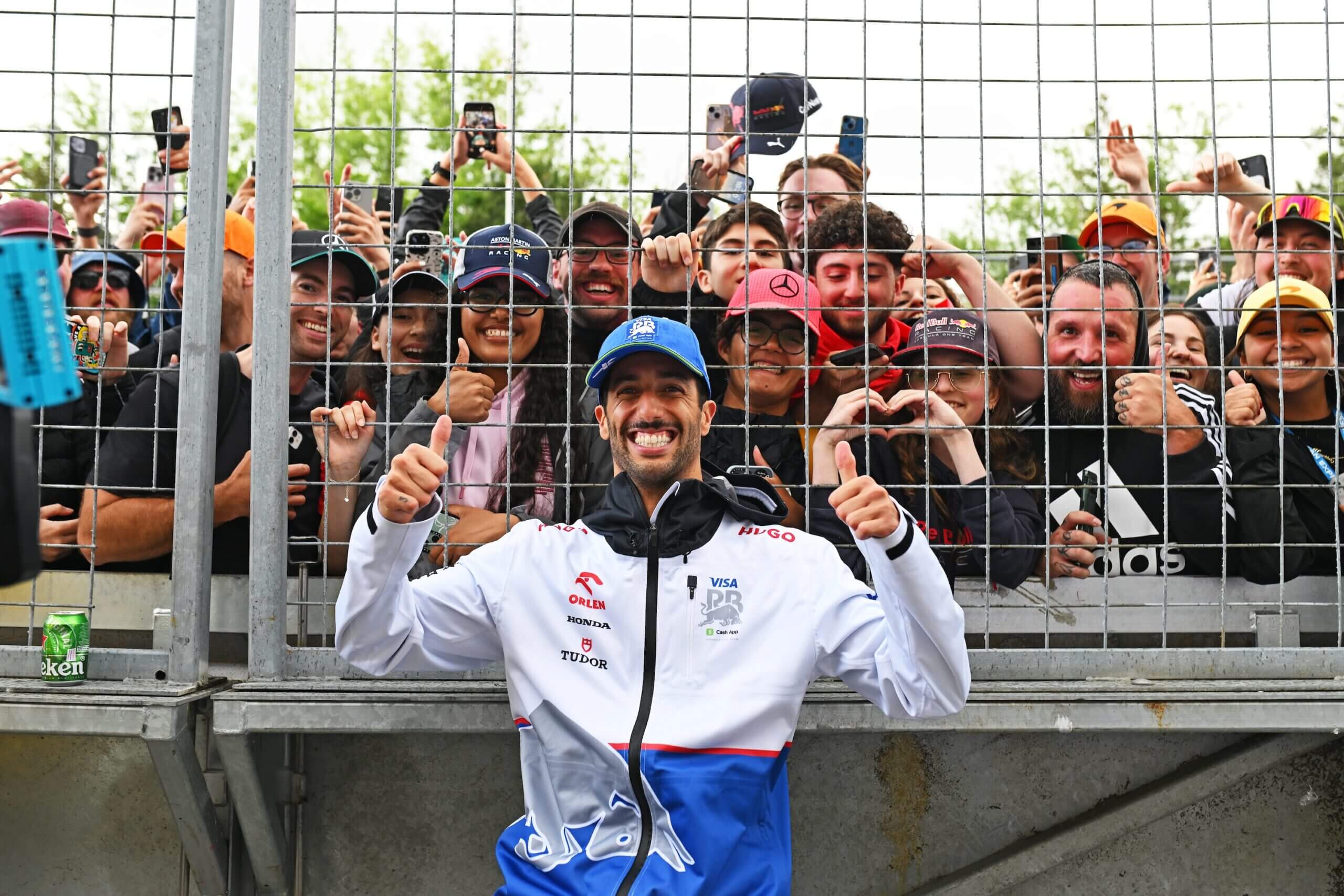 MONTREAL, QUEBEC - JUNE 09: 8th placed Daniel Ricciardo of Australia and Visa Cash App RB celebrates with fans after the F1 Grand Prix of Canada at Circuit Gilles Villeneuve on June 09, 2024 in Montreal, Quebec. (Photo by Rudy Carezzevoli/Getty Images)