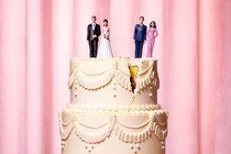 Male-female doll couples (one pair in wedding outfits, the other in evening wear) atop a cracked wedding cake