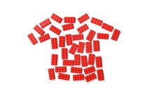 illustration of red lego bricks arranged in the shape of a child's T-shirt on white background