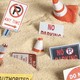 Traffic cones and "Private Property" and "No Trespassing" signs scattered in sand