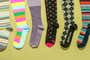 Six pairs of compression socks that we tested, in various colors and patterns.