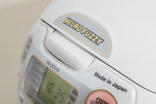 Close up of the the Zojirushi Neuro Fuzzy NS-ZCC10 rice cooker logo