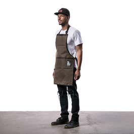 A person wearing a brown Inside Line Equipment Work Apron.