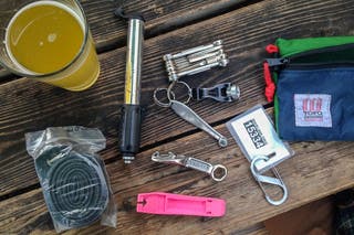 A cycler's commuter kit including tubes and a tire leaver and tools.