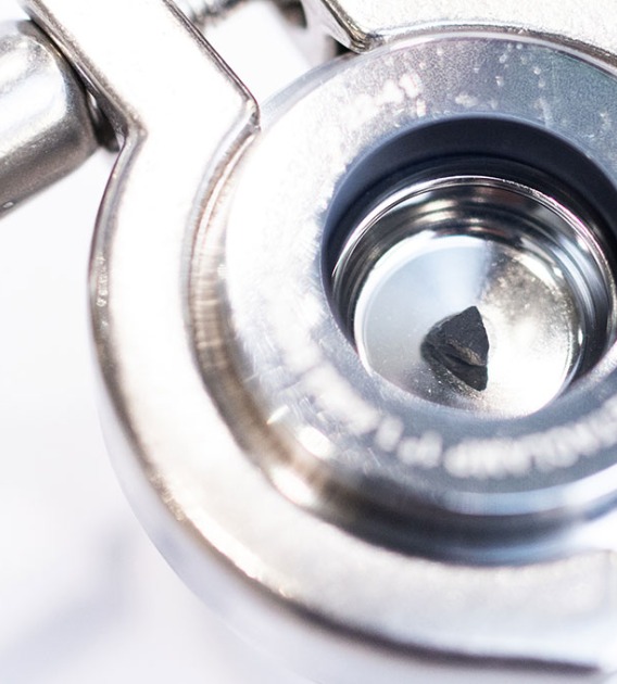 Tucked inside a clear container protected by a metal casing, the pebble collected from asteroid Bennu by the OSIRIS-REx spacecraft is one of only three places in the world to display an extraterrestrial rock sample collected in space (other than the moon)