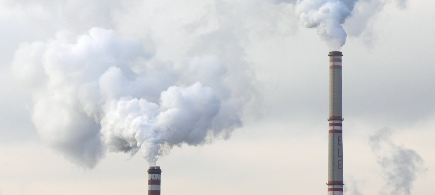 Imdustrial chimneys emitting smoke into the air