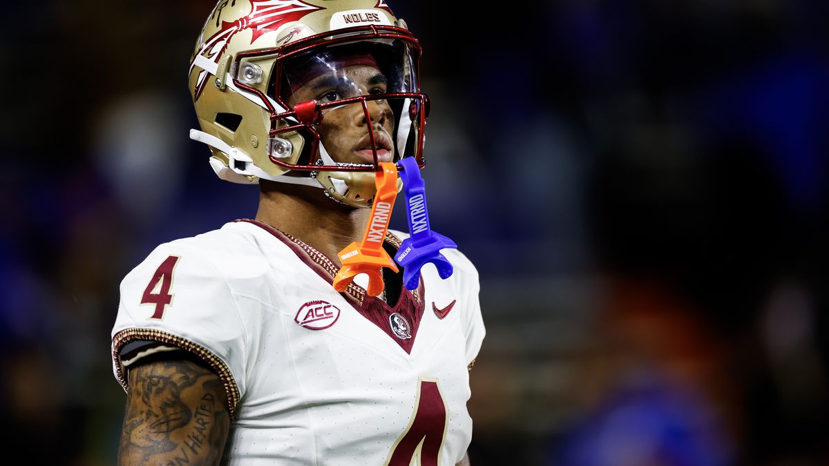 Keon Coleman #4 of the Florida State Seminoles warms up before the start of a game against the Florida Gators at Ben Hill Griffin Stadium on November 25, 2023 in Gainesville, Florida.