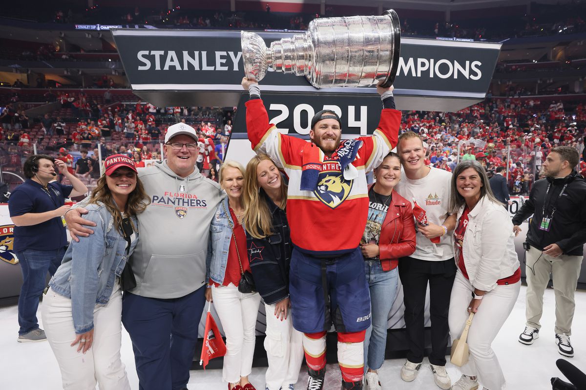 The Tkachuk family celebrates with the Stanley Cup following a 2-1 victory over the Edmonton Oilers in Game Seven of the 2024 NHL Stanley Cup Final at Amerant Bank Arena on June 24, 2024 in Sunrise, Florida.