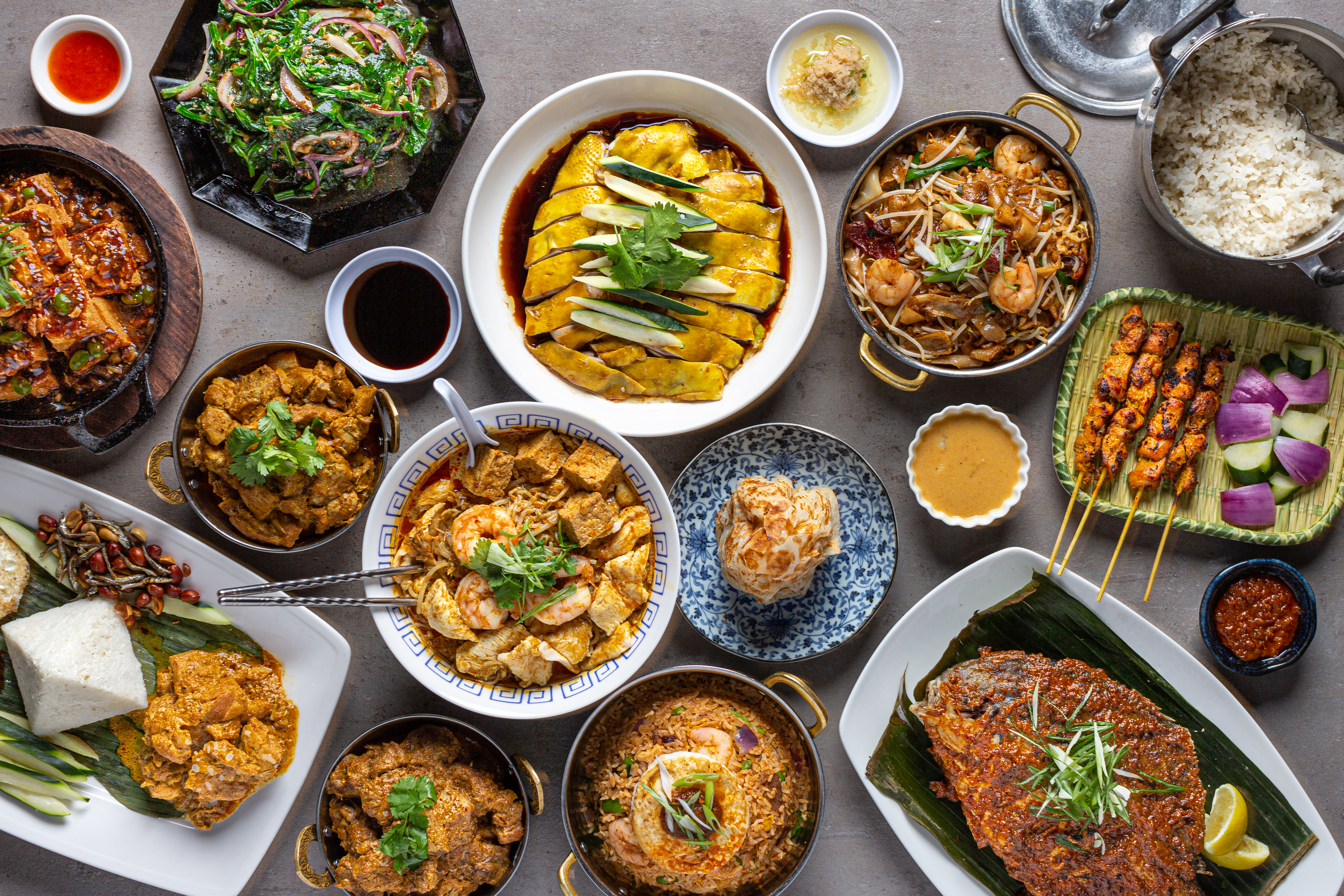 Multiple dishes in a spread at Phat Eatery.